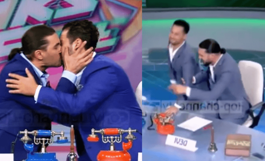 VIDEO/Pas puthjes në buzë, moderatorët ‘tërheqin vëmendjen’duke u rrëzuar në skenë